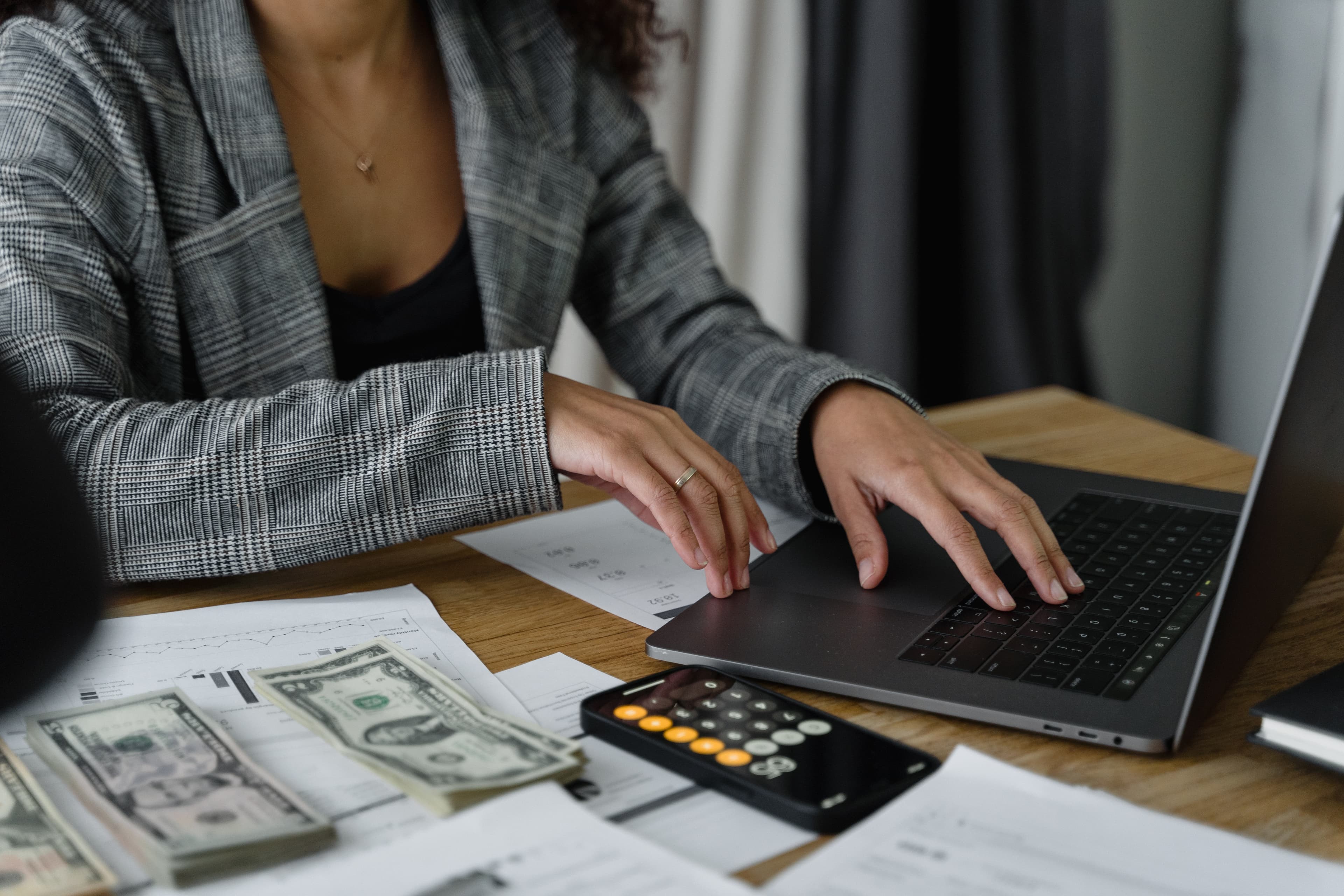 an actuary at work surrounded by money